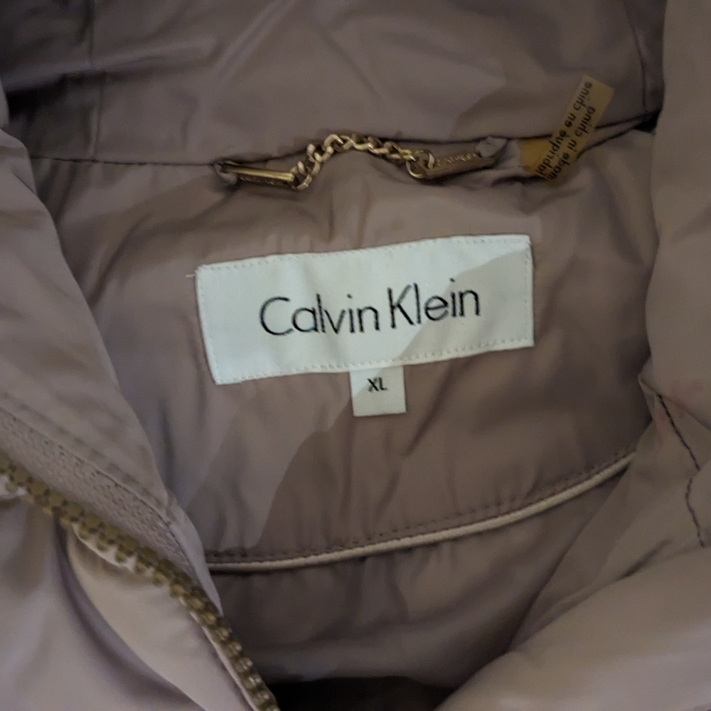 Winter down jacket from Calvin Klein In cream color. Size XL